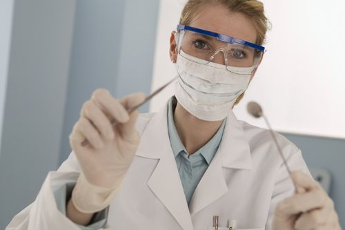 A dentist using tools